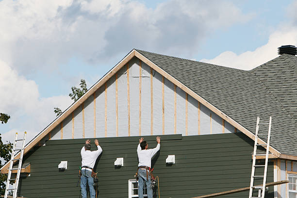 Professional Siding Contractor technician working in Dedham, MA